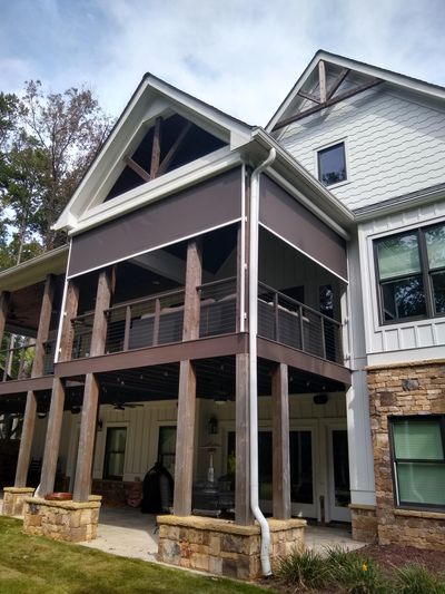 Custom solar shades installed on a porch